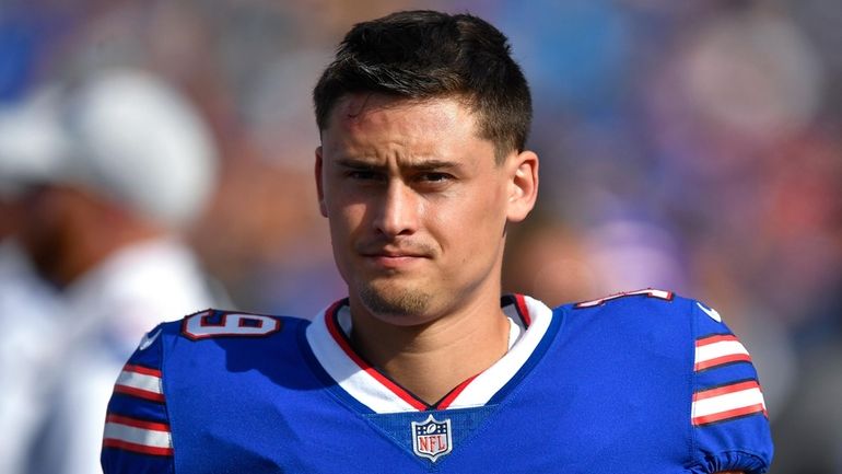 Buffalo Bills punter Matt Araiza walks on the sideline during...