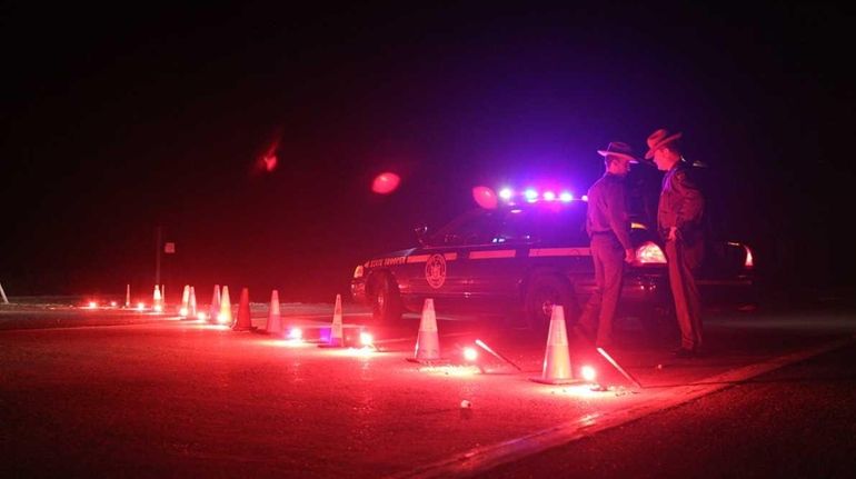 Ocean Parkway is closed as police search Gilgo Beach Tuesday...