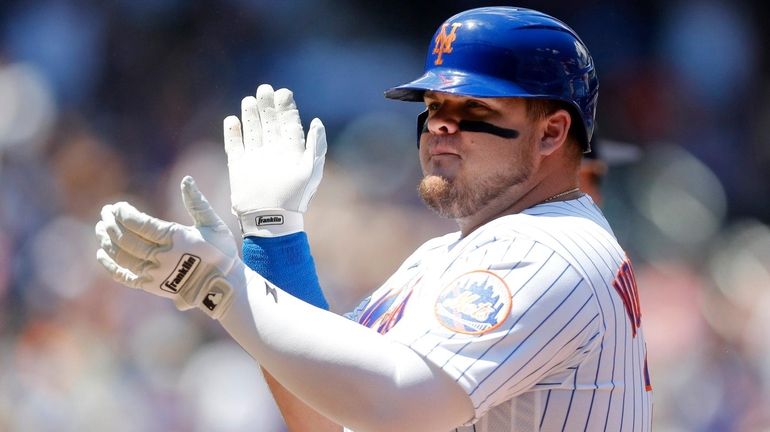 Daniel Vogelbach #32 of the Mets reacts after his first inning...