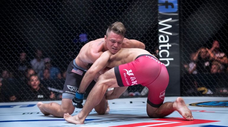 Islip's Chris Wade, left, chokes Yuki Kawana during a PFL5...