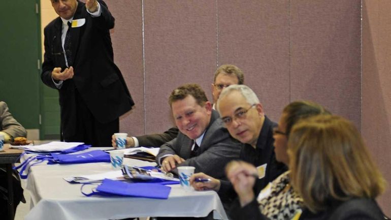 On left, Mark J. Grossman, commissioner's Long Island regional representative,...