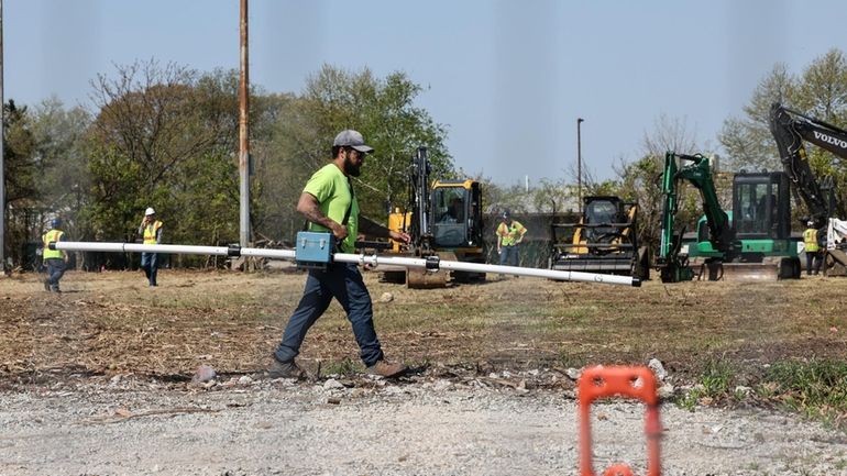 A member of the work crew searching last month for...