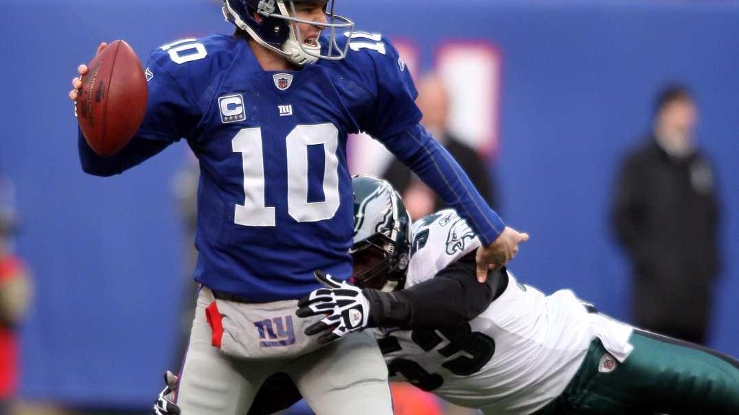 New York Giants quarterback Eli Manning looks disappointed while talking to  the coaches up stairs. The Philadelphia Eagles defeated the New York Giants  27 to 6 at Giants Stadium in East Rutherford