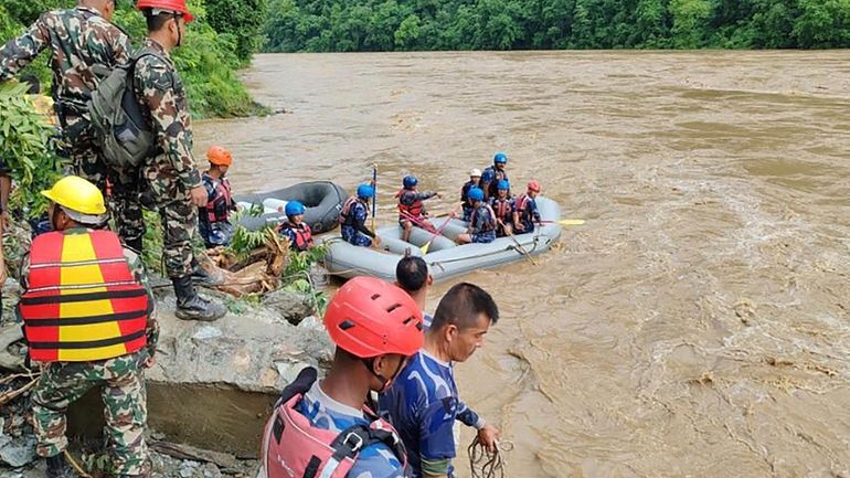 In this handout photograph released by Nepal Armed Police force,...