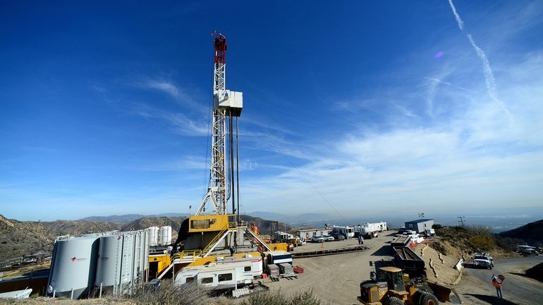 Crews from SoCalGas and outside experts work on a relief...