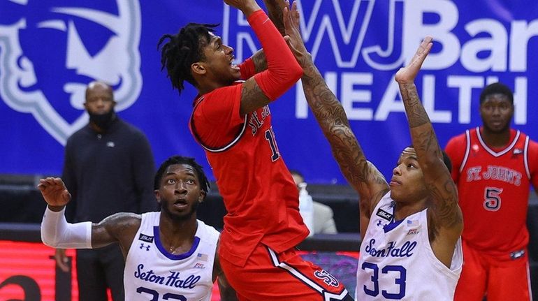 St. John's Red Storm guard Vince Cole goes to the basket...