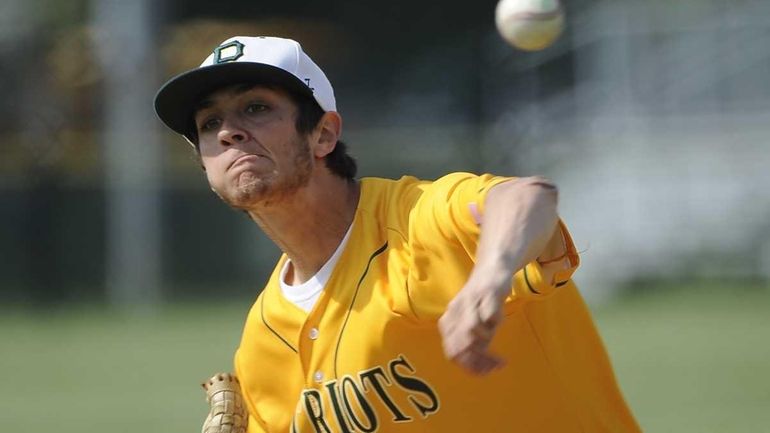 Ward Melville pitcher Anthony Kay delivers against Hauppauge in the...