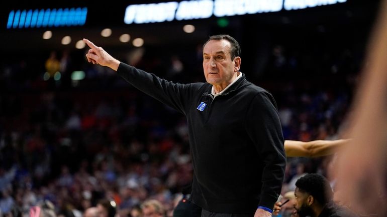 Duke head coach Mike Krzyzewski yells to his team during...