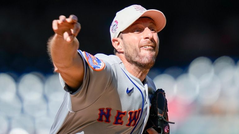 Mets starting pitcher Max Scherzer throws during the first inning...