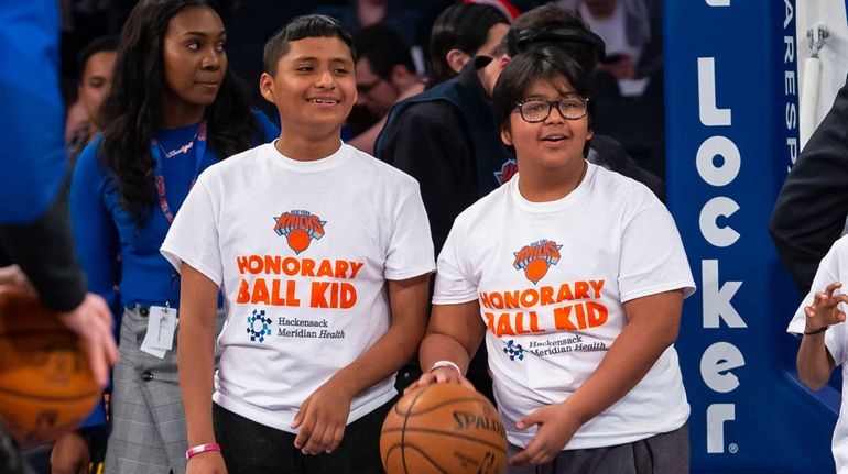 Kidsday reporters Humberto Guevara, left, and Jose Munguia stand on...