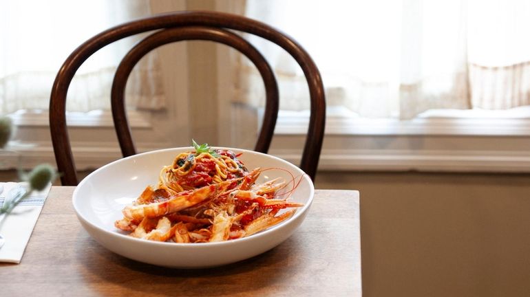 Langoustine sautéed in cherry tomato sauce, garlic, red chili, basil...