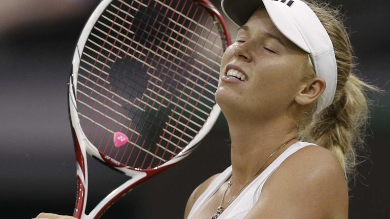 Caroline Wozniacki of Denmark reacts during a first round women's...