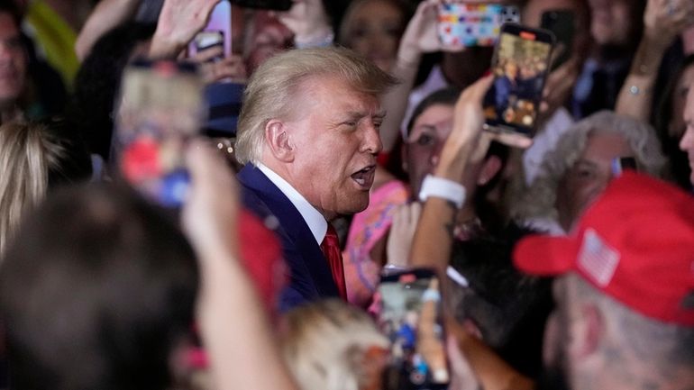 Former President Donald Trump arrives at his Mar-a-Lago estate in...