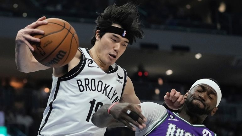 The Nets' Yuta Watanabe and the Bucks' Bobby Portis go...