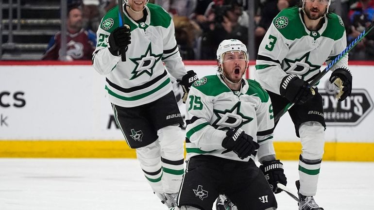 Dallas Stars center Matt Duchene, front, celebrates after scoring the...