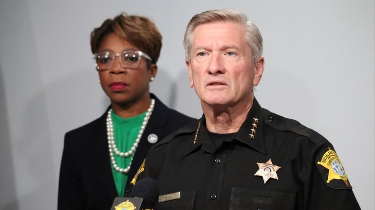 Richland County Sheriff Leon Lott, right, and Councilmember Gretchen Barron...