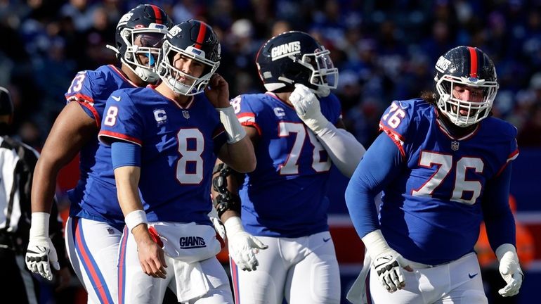 Daniel Jones of the Giants reacts after his fumble during the first...