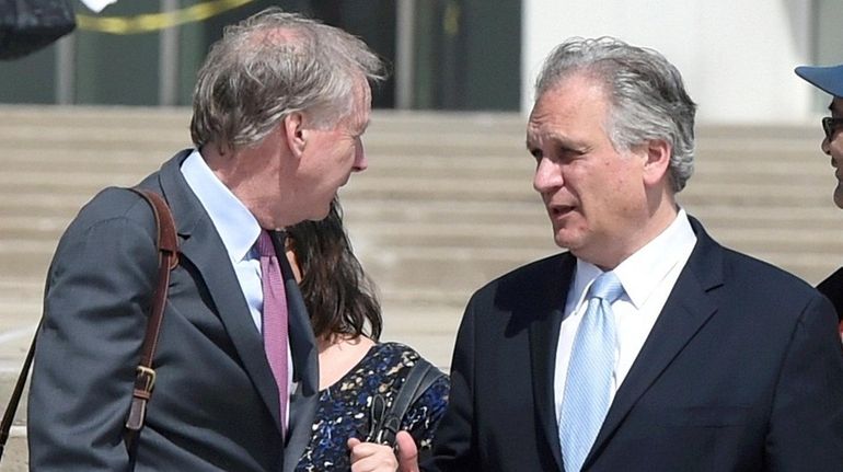 Edward and Linda Mangano outside federal court in Central Islip...