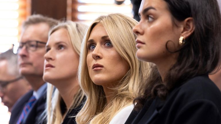 Former collegiate swimmers Kaitlynn Wheeler, from third left, Riley Gaines,...