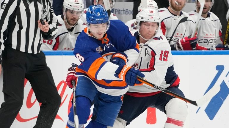 Islanders defenseman Noah Dobson (8) skates against Washington Capitals center...