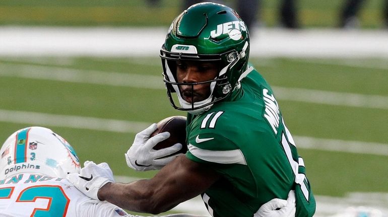 Denzel Mims of the Jets runs a reception during the...