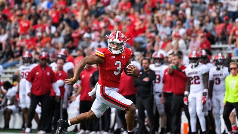 Maryland quarterback Taulia Tagovailoa (3) runs the ball for a...