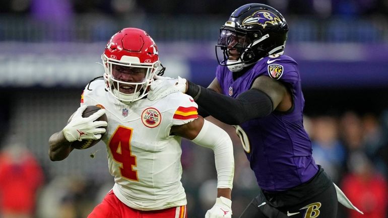 Kansas City Chiefs wide receiver Rashee Rice (4) is tackled...