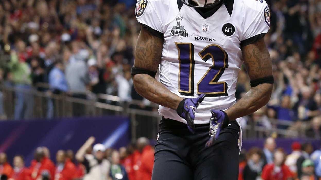 Baltimore Ravens wide receiver Jacoby Jones takes a kickoff the