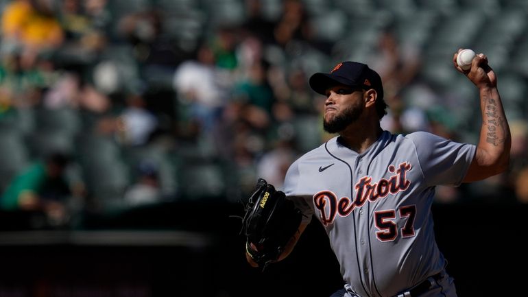 Detroit Tigers pitcher Eduardo Rodriguez throws to an Oakland Athletics...