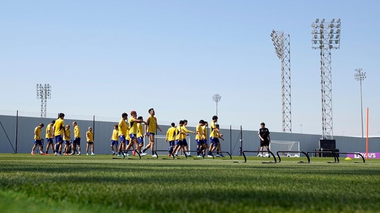 Players warm up during Japan official training on the eve...