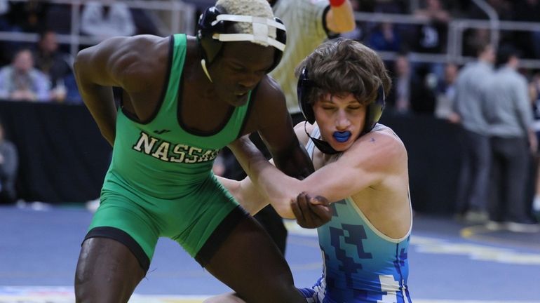 Dunia Sibomana-Rodriguez of Long Beach (left) wrestles Luke Satriano of Valley...