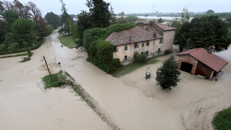 The Lamone river overflows its banks near Bagnacavallo, in the...