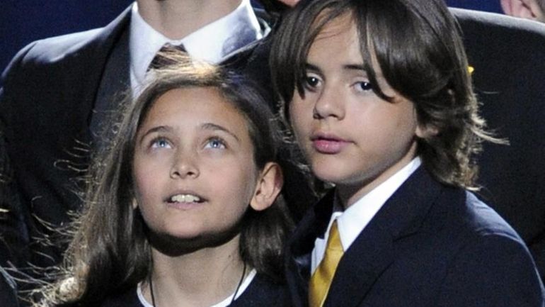 Paris Jackson, left, and Prince Michael Jackson I stand together...