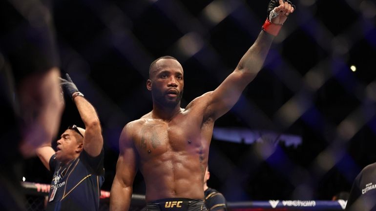 Leon Edwards celebrates after the welterweight title between Leon Edwards...