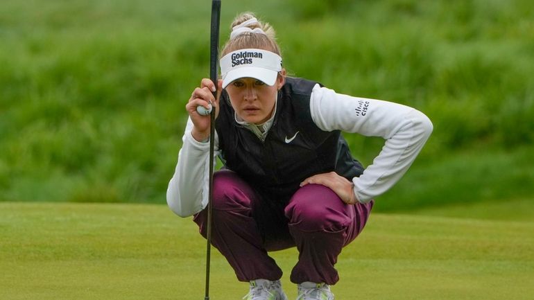 Nelly Korda lines up a shot on the 14th green...