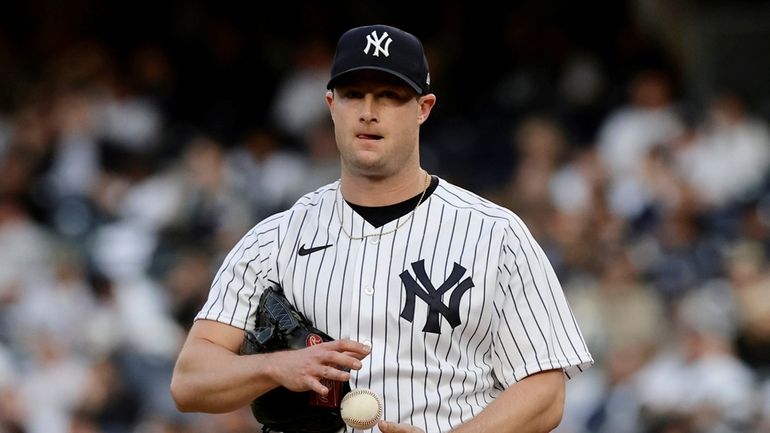 Gerrit Cole #45 of the New York Yankees reacts on...