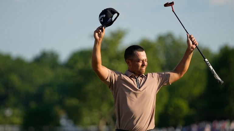 Xander Schauffele celebrates after winning the PGA Championship golf tournament...