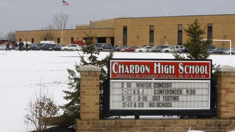 Students exit Chardon High School Monday, in Chardon, Ohio. (Feb....