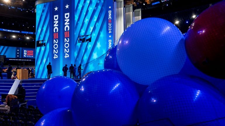 Workers prepare for next week's Democratic National Convention at the...