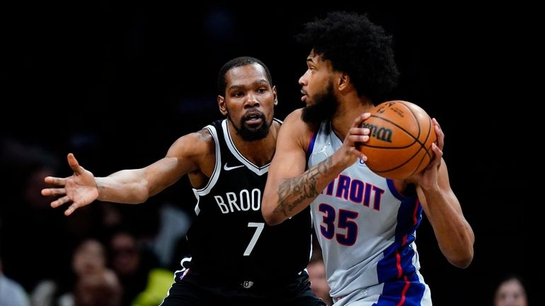 Brooklyn Nets' Kevin Durant (7) defends Detroit Pistons' Marvin Bagley...