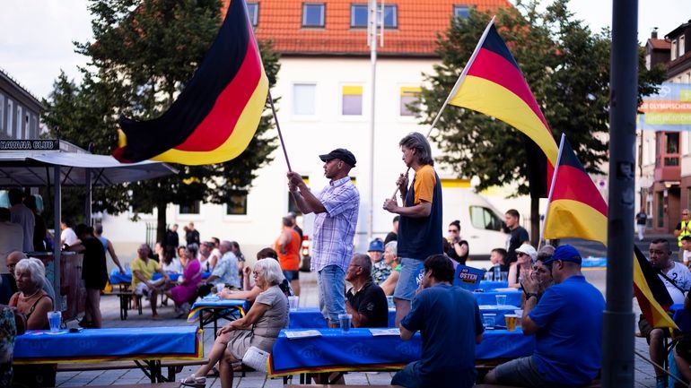 Supporters of the far-right Alternative for Germany party, or AfD,...