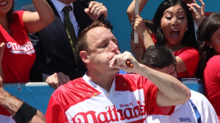 Joey Chestnut on his way to eating 71 hot dogs...