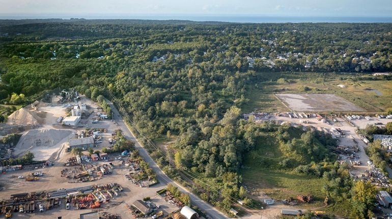 The wedge-shaped wooded area is the former Steck and Philbin landfill...