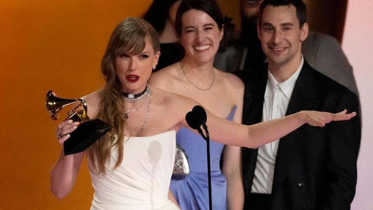 Taylor Swift accepts the award for album of the year...