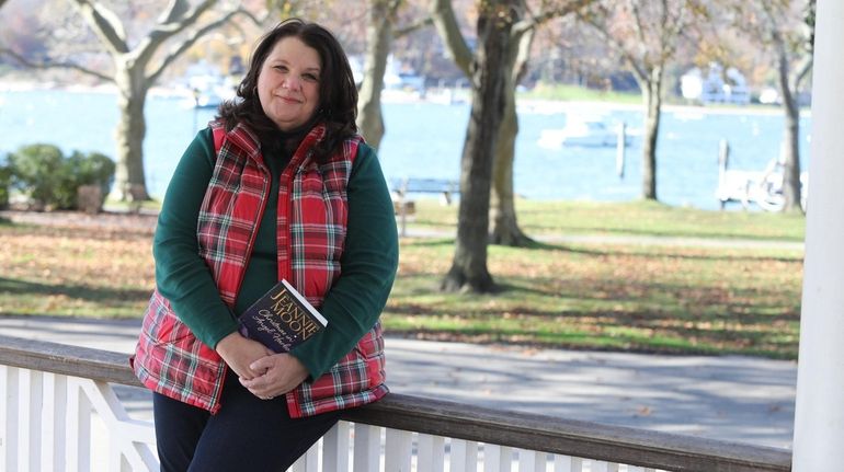 Huntington novel Jeannie Moon relaxes at Northport Village Park, which is...