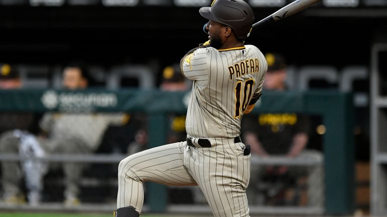 San Diego Padres' Jurickson Profar watches his three-run double during...