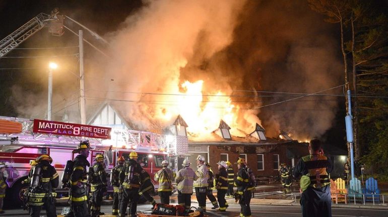 Firefighters at the scene of a fire on Main Road...