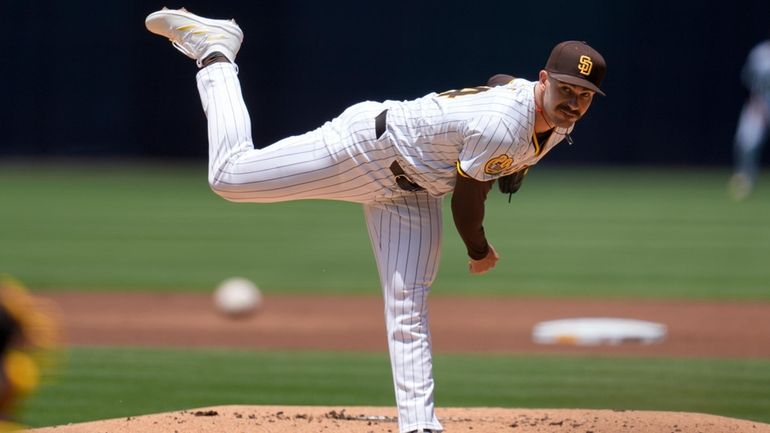 San Diego Padres starting pitcher Dylan Cease works against a...