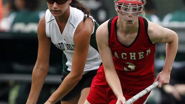 Sachem East's Kristen Bagley (3) moves the ball upfield as...