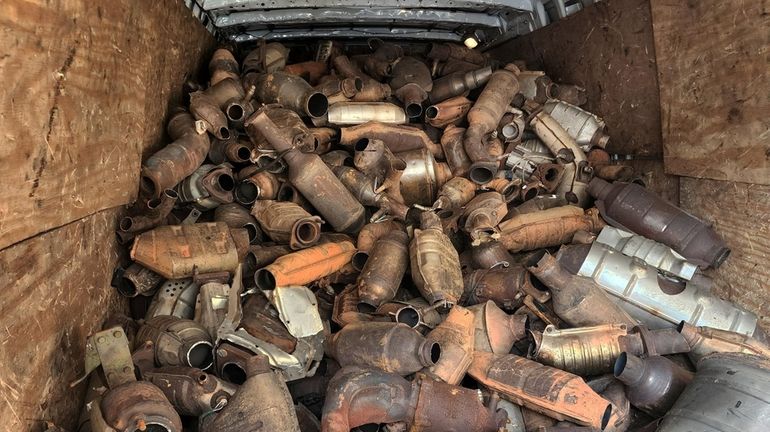 A van containing seized catalytic converters that were stolen is...